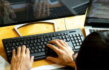 a person typing on a computer keyboard