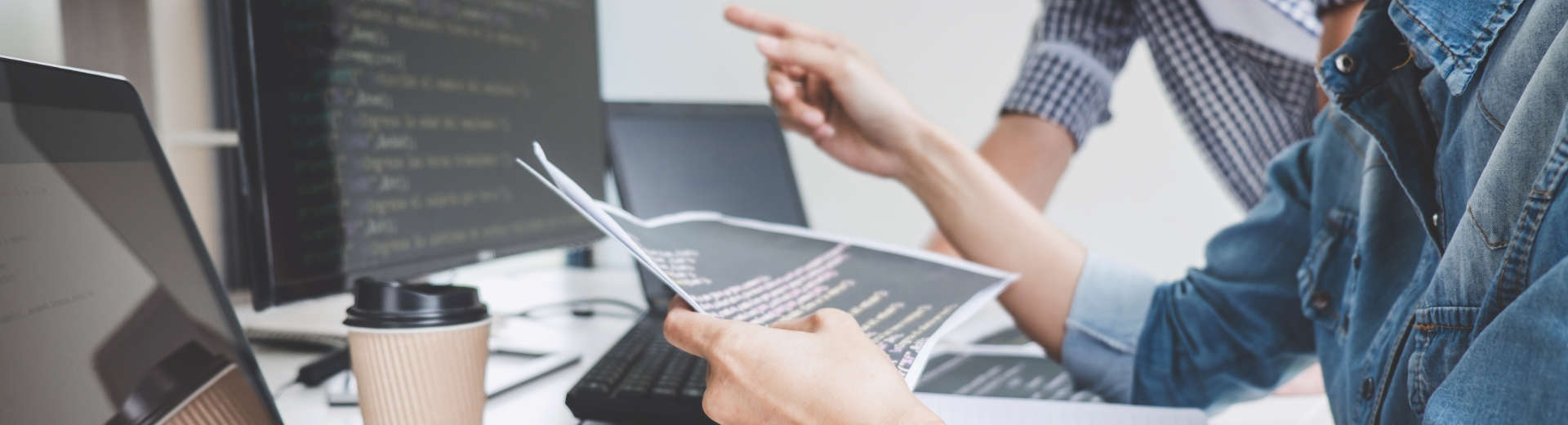 people in front of a computer analysing data