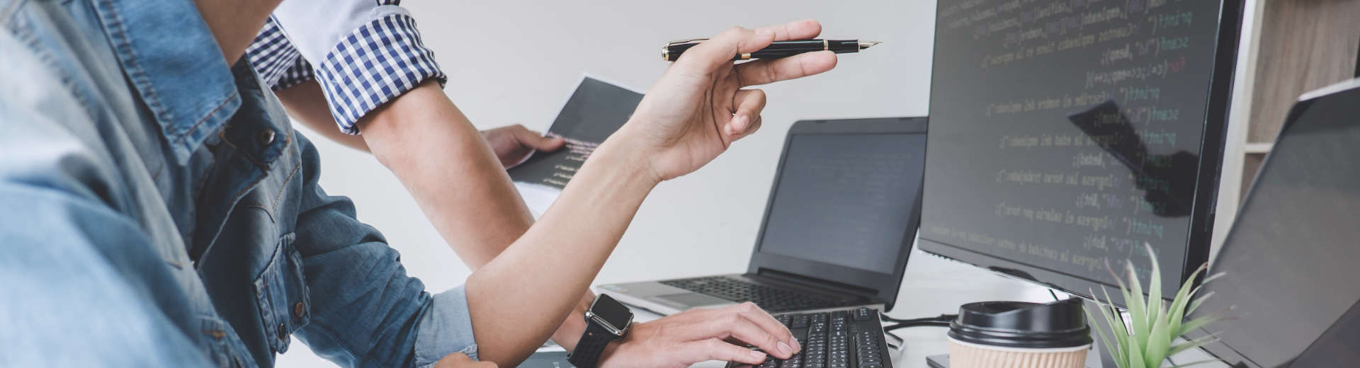 accounters working on computers and laptops