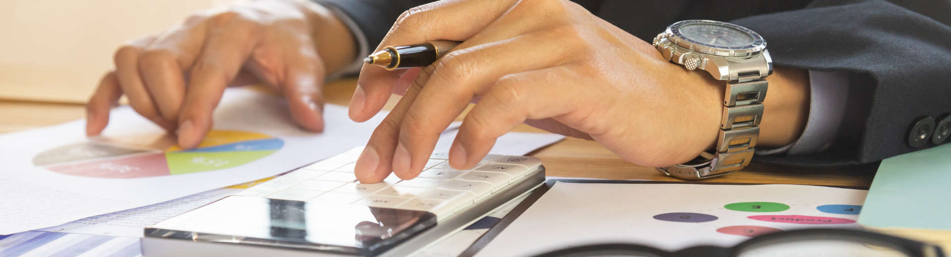 a businessman analising charts with business data