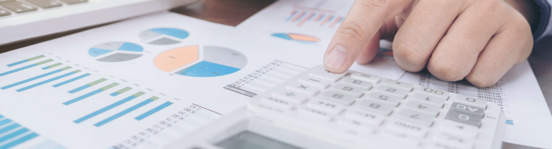 a businessman analising charts with business data