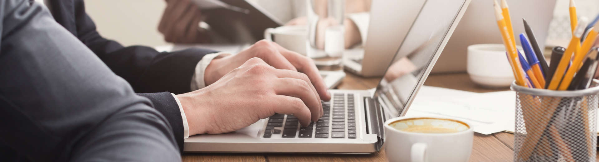 businessman typing on a laptop